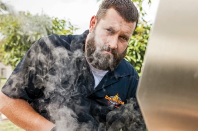 Bar-B-Clean franchisee cleaning a barbecue grill