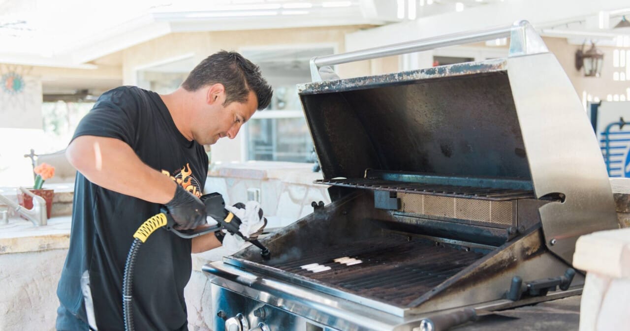 Bar-B-Clean franchisee cleaning a barbecue