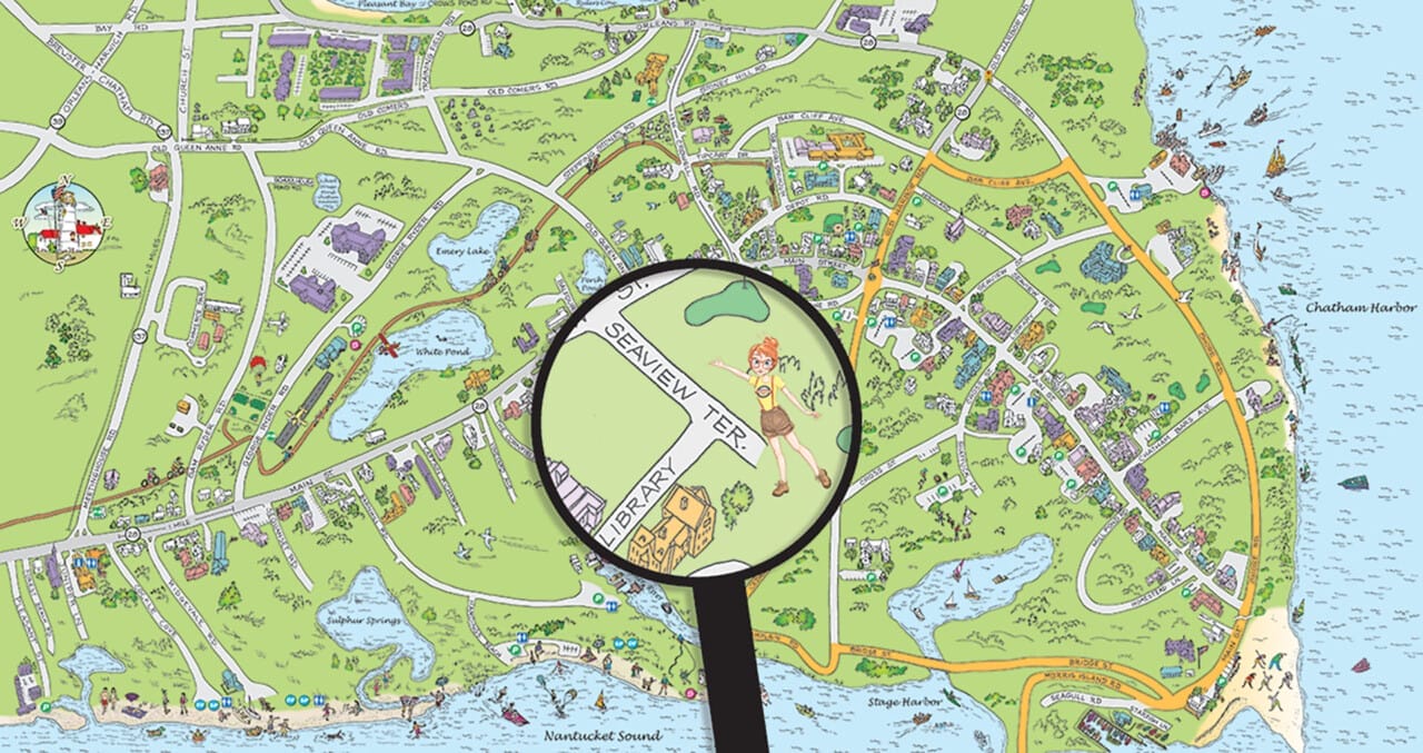 A Discovery Map International tourist map with a magnifying glass highlighting a specific area.