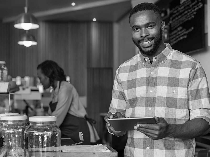 smiling franchise owner at work