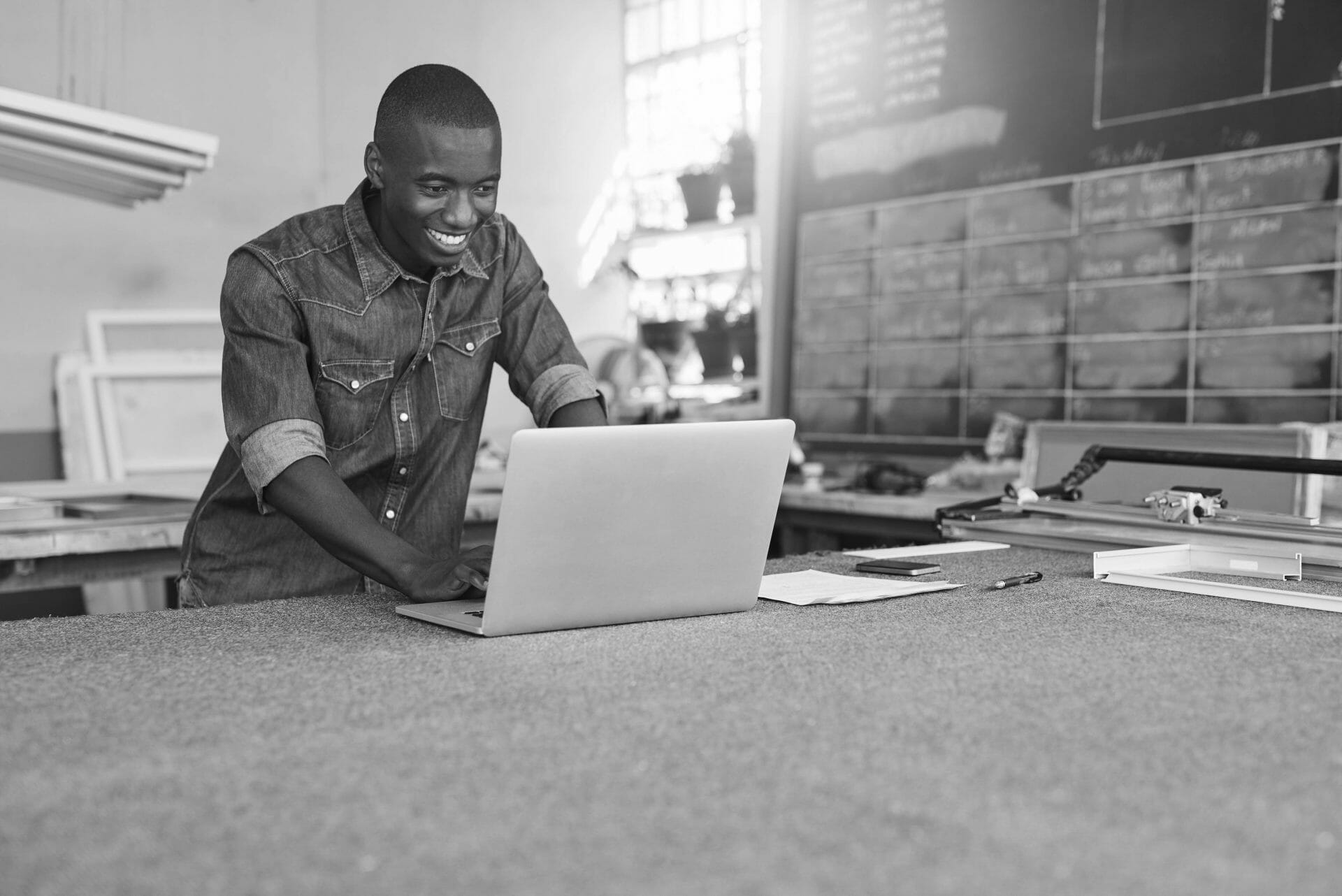 Man at laptop determining the best franchises to own